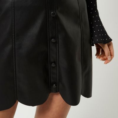 Black leather look scallop hem mini skirt